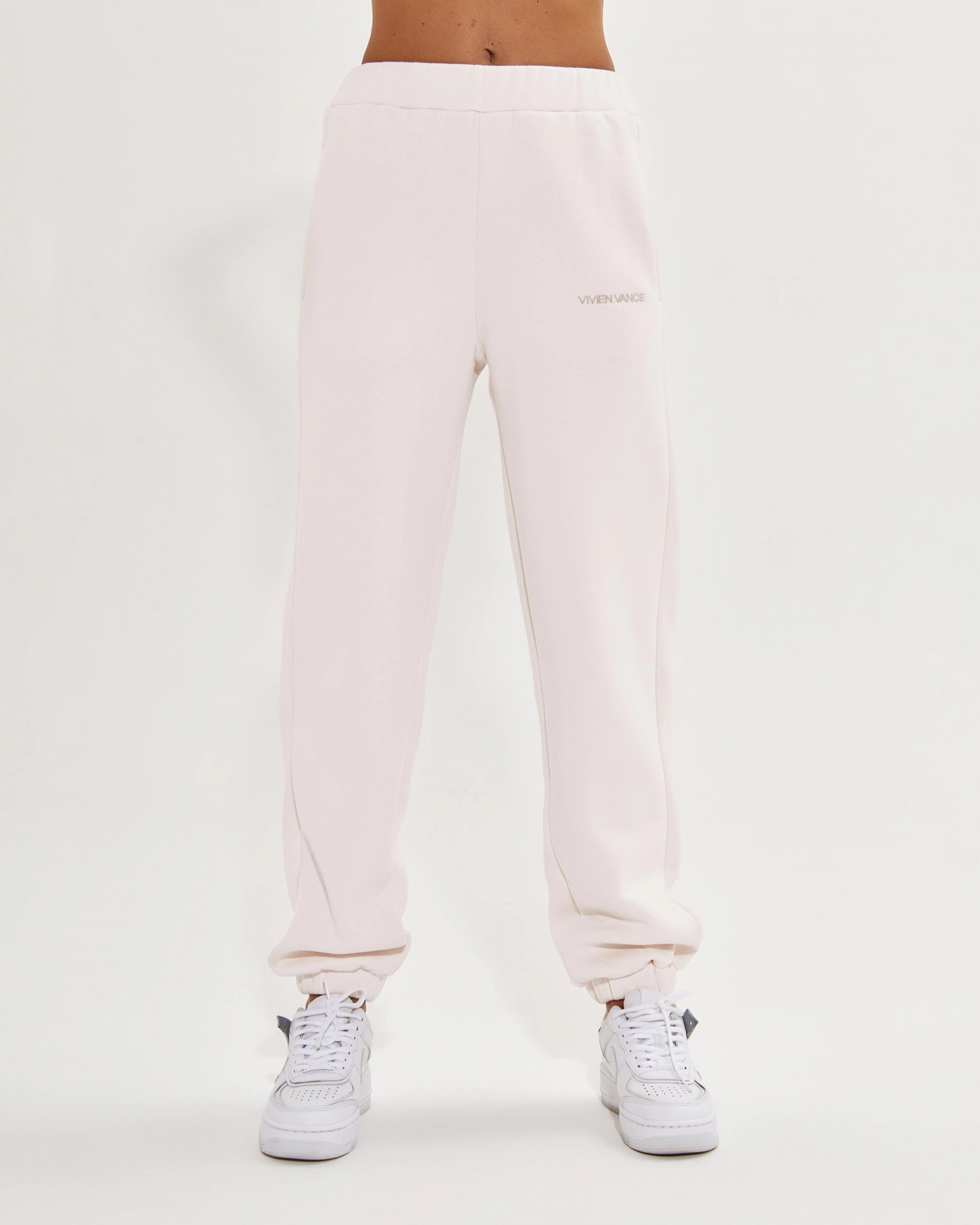 White Joggers with elastic waist and gold embroidery
